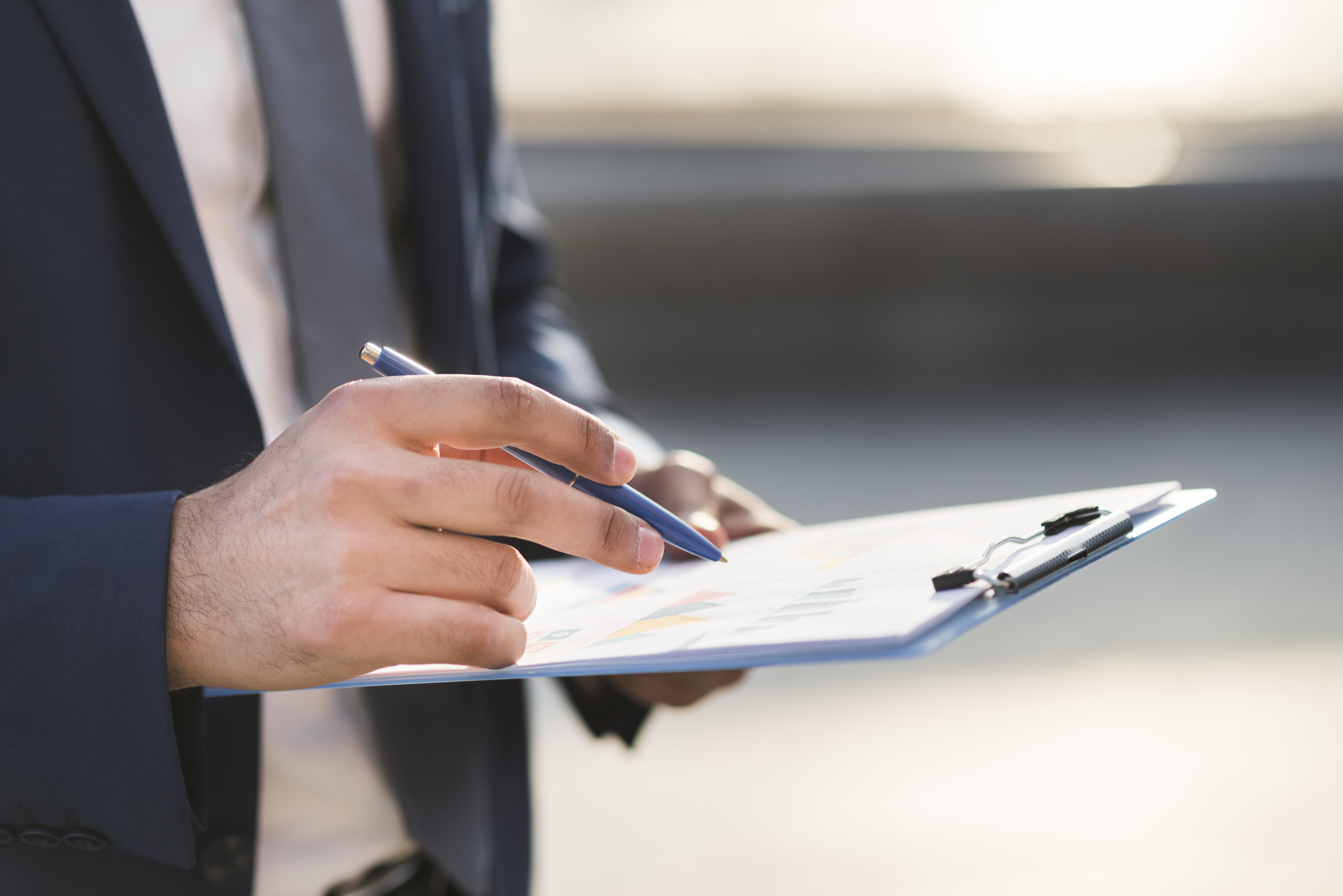 close-up-business-man-checking-clipboard.jpg close-up-business-man-checking-clipboard.jpg