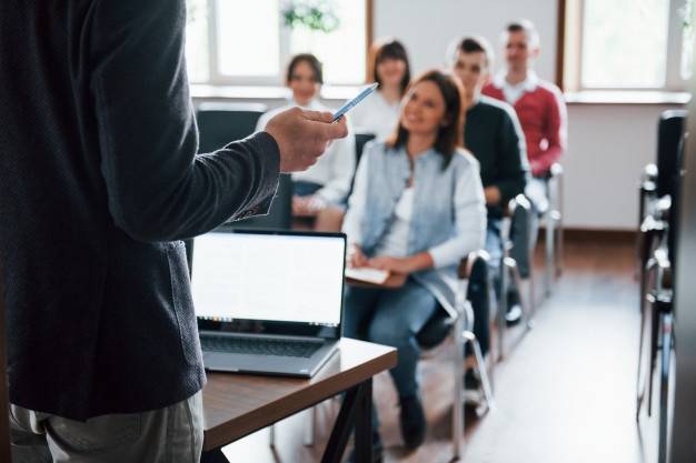 everyone-is-smiling-listens-group-people-business-conference-modern-classroom-daytime_146671-1628826.jpg