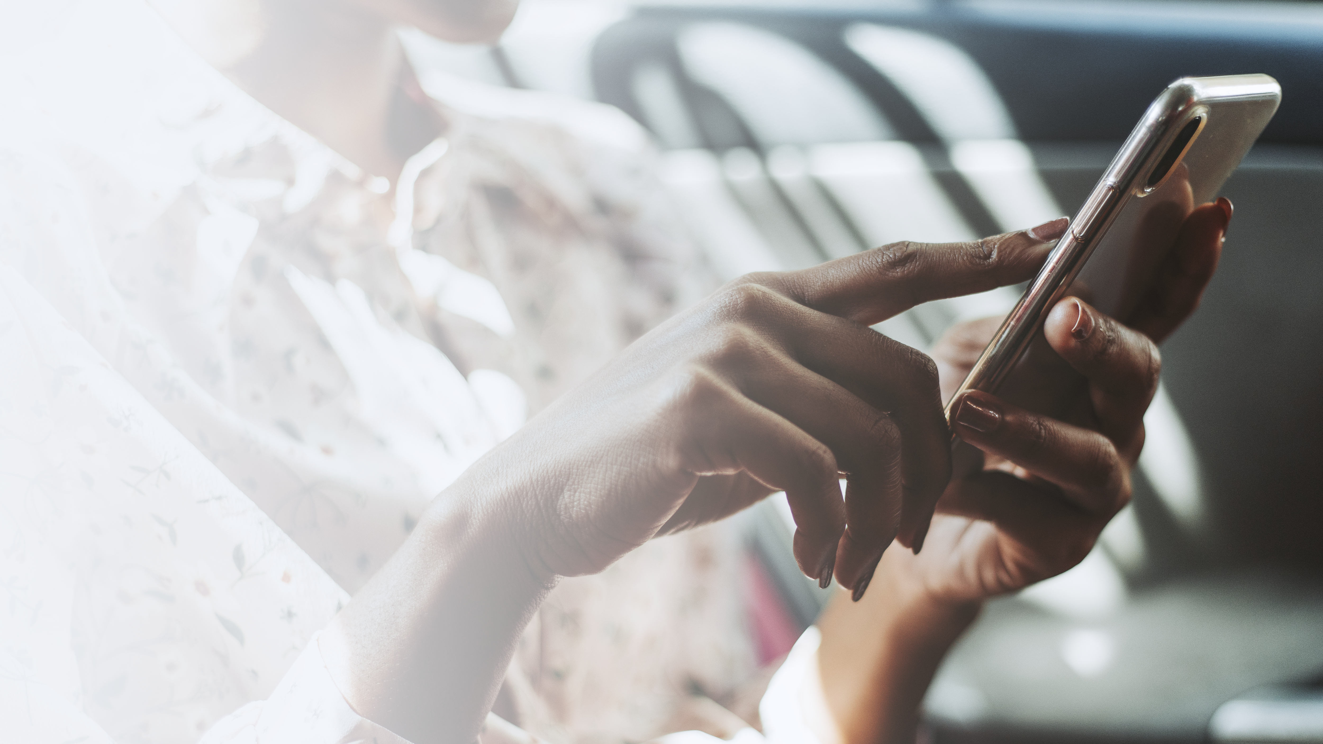 woman-using-phone-car.jpg