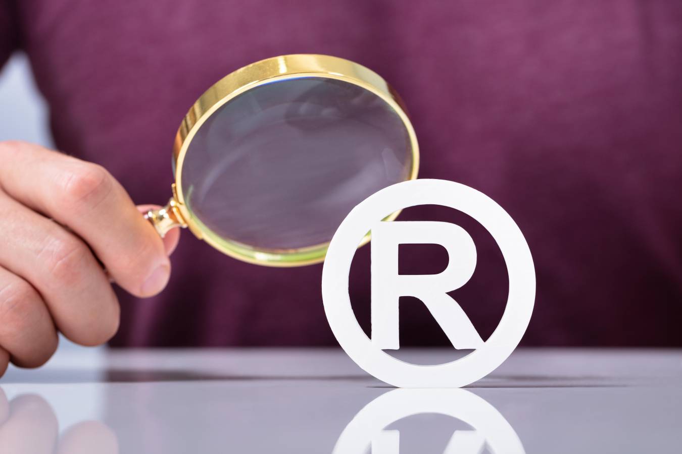registered-trademark-icon-looking-through-magnifier.jpg