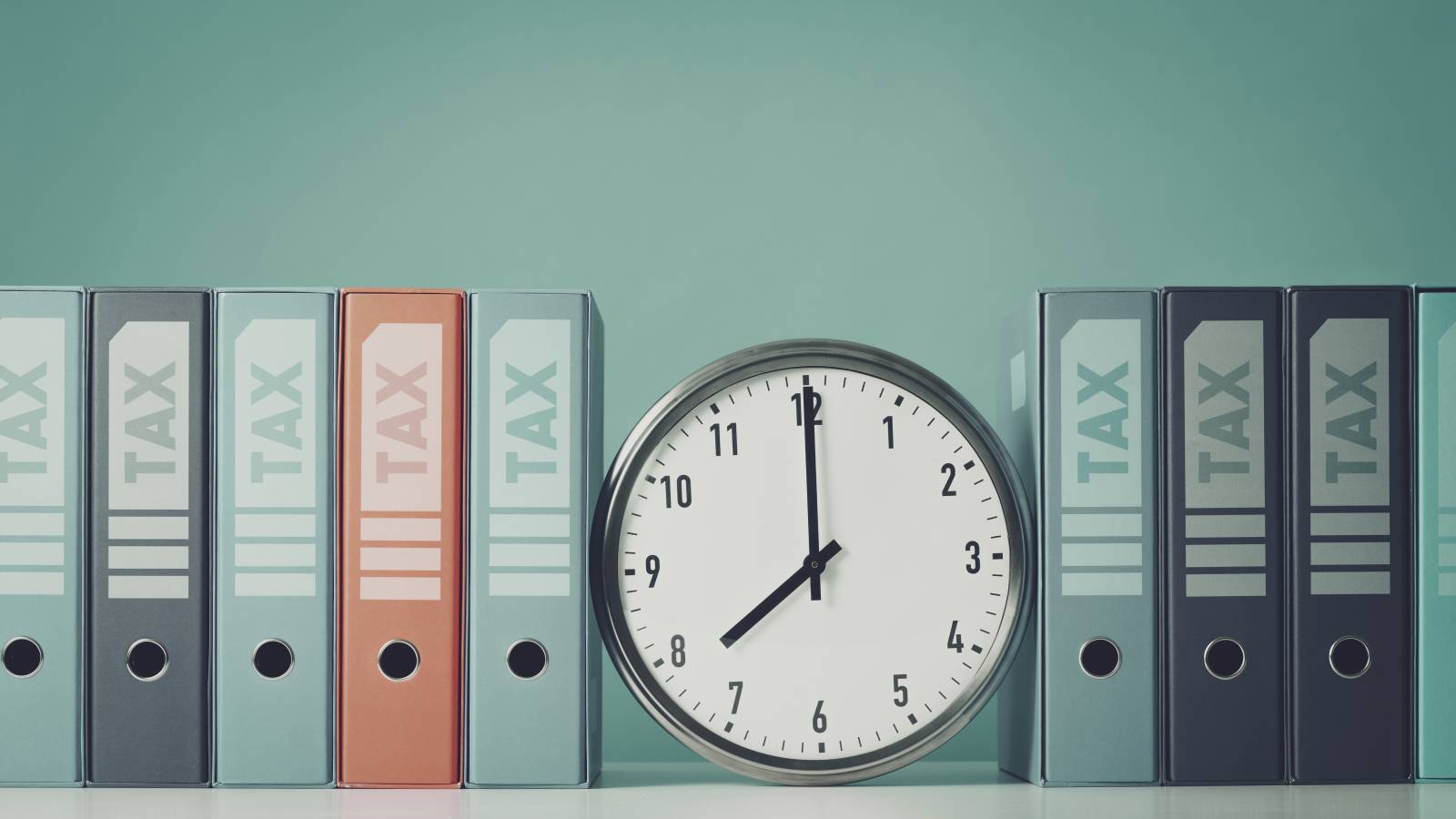 ring-binders-containing-tax-documents-clock.jpg
