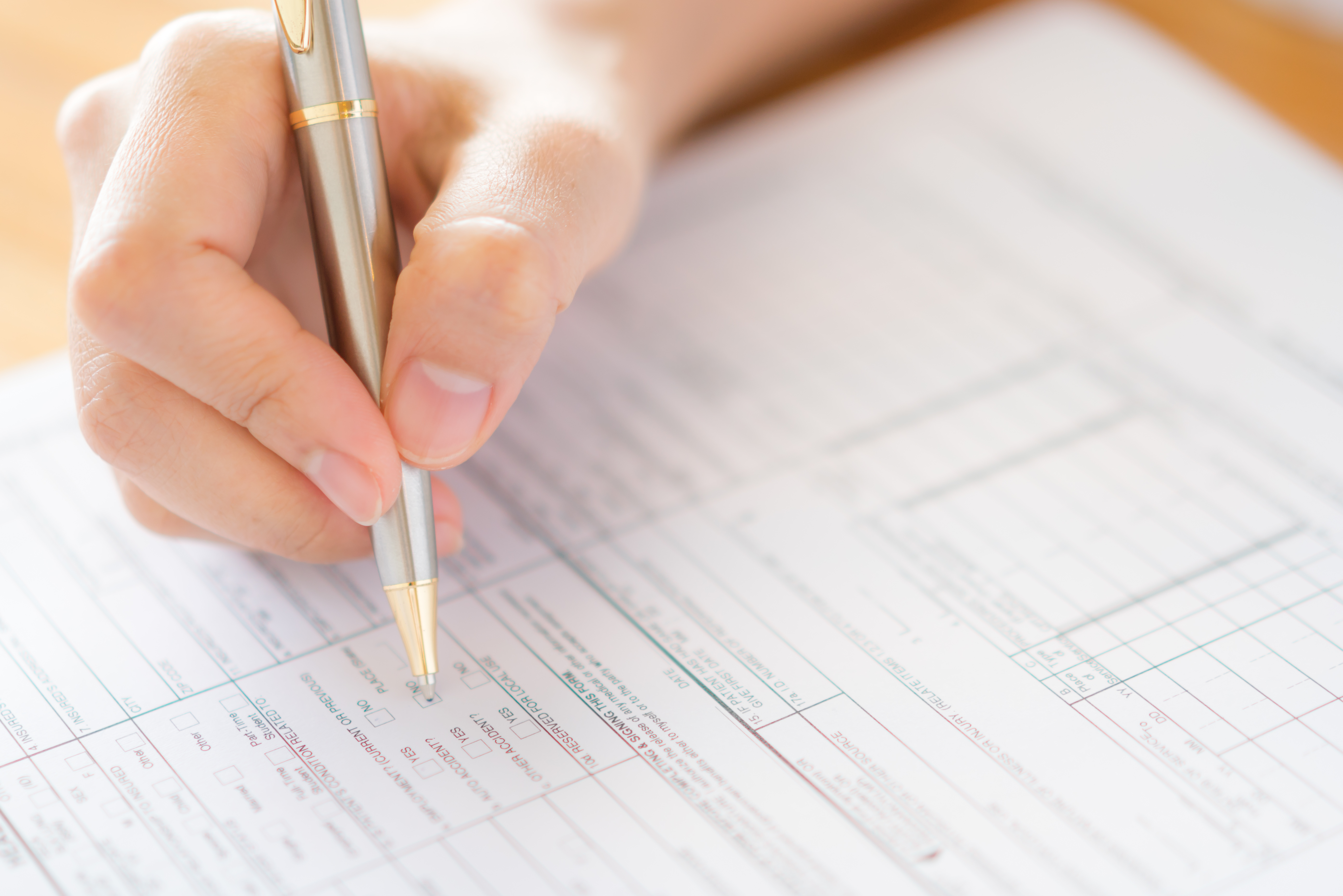 hand-with-pen-application-form.jpg