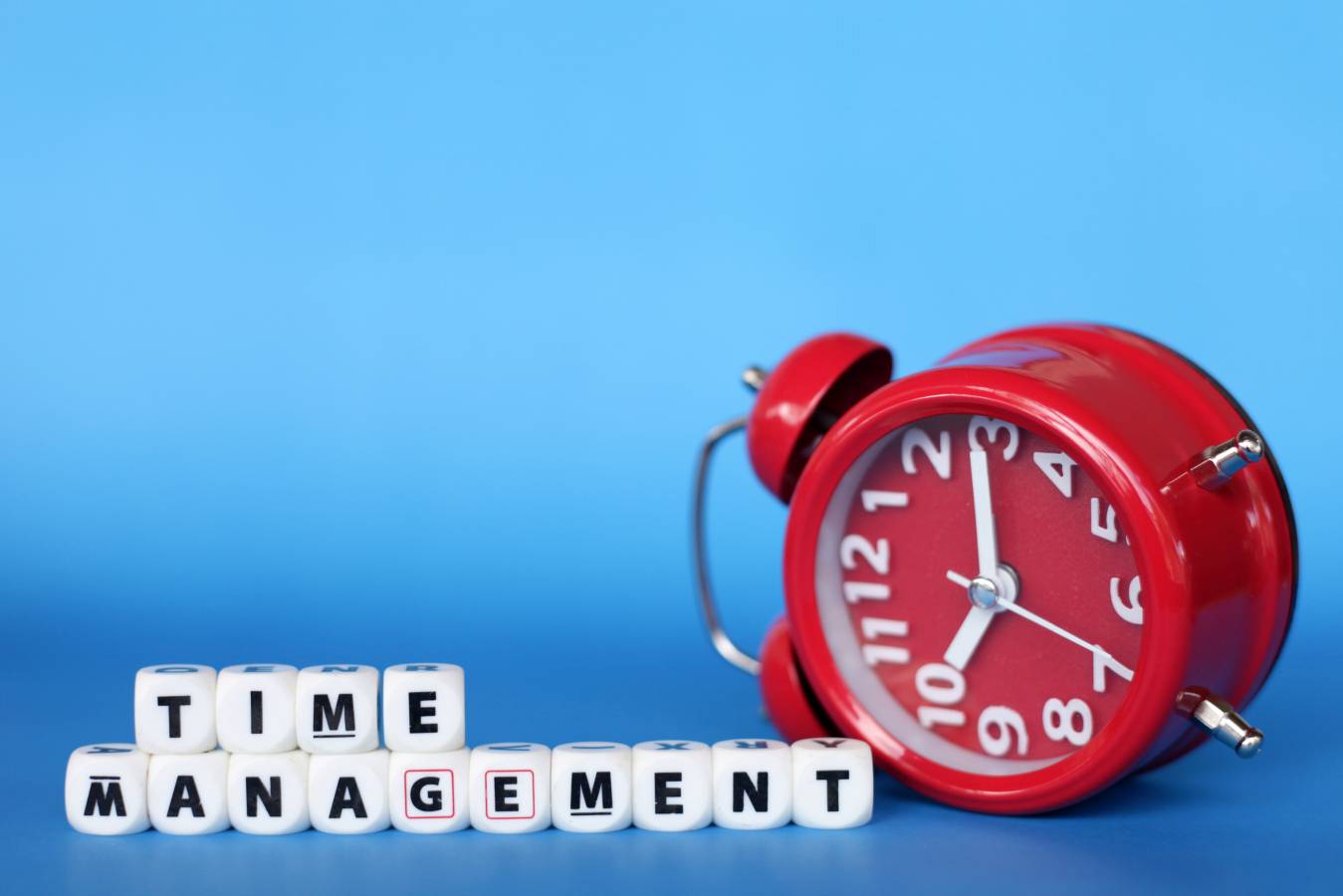 time-management-conceptual-with-word-block-clock-blue-background.jpg