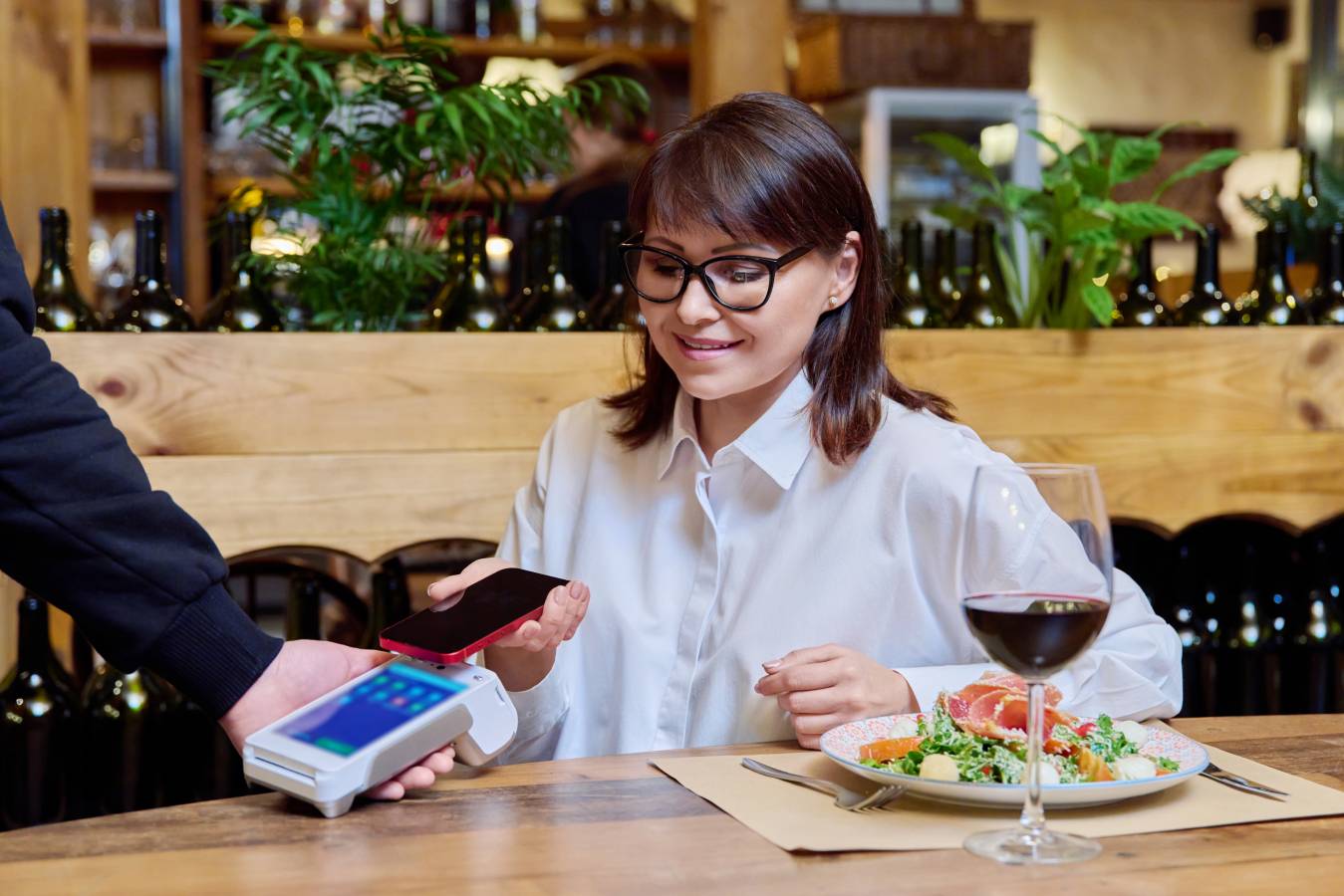 woman-restaurant-paying-order-using-smartphone-terminal.jpg