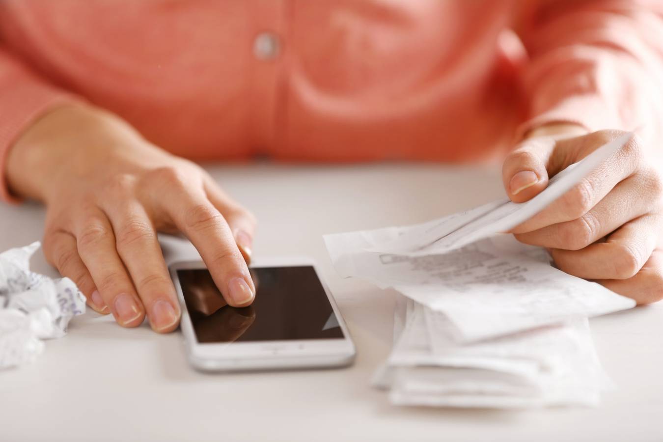 woman-with-bills-smart-phone-table-calculation-costs.jpg woman-with-bills-smart-phone-table-calculation-costs.jpg